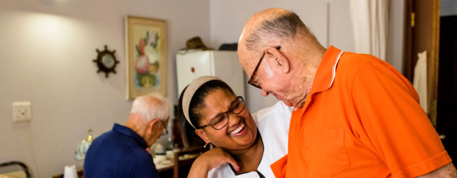 caregiver and man in a nursing home